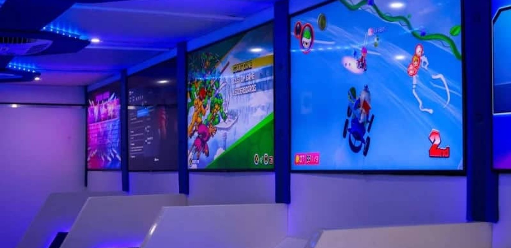 Students playing video games together inside a mobile gaming trailer