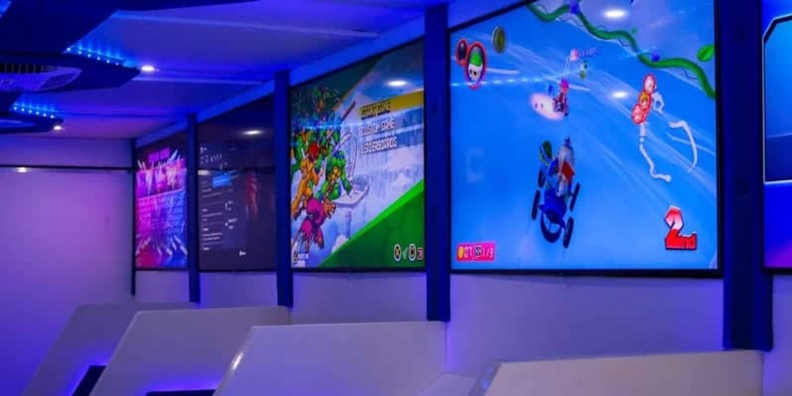 Students playing video games together inside a mobile gaming trailer